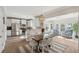 Bright, open-concept living space with a seamless flow between the kitchen, dining, and living areas at 225 Nelliefield Creek Dr, Wando, SC 29492