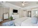 Spacious main bedroom with trey ceiling, flat screen television, and serene atmosphere at 225 Nelliefield Creek Dr, Wando, SC 29492