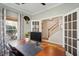 Well-lit home office with a substantial wooden desk, offering a functional and stylish workspace at 225 Nelliefield Creek Dr, Wando, SC 29492