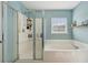 Bathroom showcases a glass enclosed shower and a luxurious soaking tub at 225 Nelliefield Creek Dr, Wando, SC 29492