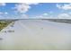 Expansive aerial view of the tranquil river with boats docked along the lush shoreline at 2516 Willbrook Ln, Mount Pleasant, SC 29466