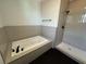 Bathroom with soaking tub and tiled walk-in shower at 2516 Willbrook Ln, Mount Pleasant, SC 29466