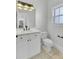 Bright bathroom with white vanity, marble countertop, modern fixtures, and neutral-toned tile at 2516 Willbrook Ln, Mount Pleasant, SC 29466