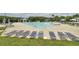 Large community pool with ample seating and umbrellas, perfect for relaxing and enjoying the outdoors at 2516 Willbrook Ln, Mount Pleasant, SC 29466