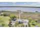Breathtaking aerial view of private dock with gazebo and boat slips, surrounded by beautiful water and marshland at 2516 Willbrook Ln, Mount Pleasant, SC 29466