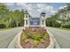 Inviting entrance to RiverTowne on the Wando with lush landscaping and a decorative community sign at 2516 Willbrook Ln, Mount Pleasant, SC 29466