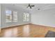 Bright and airy living room with hardwood floors, ceiling fan, and large windows at 2516 Willbrook Ln, Mount Pleasant, SC 29466