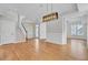 Open-concept living area with hardwood floors, staircase, and modern lighting at 2516 Willbrook Ln, Mount Pleasant, SC 29466