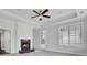 Inviting living room features a fireplace, tray ceiling, and exterior door at 2516 Willbrook Ln, Mount Pleasant, SC 29466