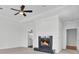 Inviting living room features a fireplace, tray ceiling, and ceiling fan at 2516 Willbrook Ln, Mount Pleasant, SC 29466