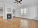 Living room featuring a fireplace, hardwood floors, and an open layout at 2516 Willbrook Ln, Mount Pleasant, SC 29466