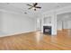 Living room featuring a fireplace, hardwood floors, and elegant trim details at 2516 Willbrook Ln, Mount Pleasant, SC 29466