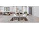 Close up of a modern kitchen island with a double sink and a view of the open floor plan at 300 Blue Haw Dr, Moncks Corner, SC 29461