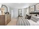 Comfortable main bedroom features neutral carpet, natural light, and decorative wall mirror at 300 Blue Haw Dr, Moncks Corner, SC 29461