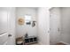 Organized mud room with storage bench, hooks, and a neutral color palette at 307 Pine Crest View Dr, Summerville, SC 29486