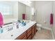 Bathroom with double sink vanity, a large mirror and storage cabinets at 322 Freeland Way, Moncks Corner, SC 29461