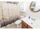 Well-lit bathroom with vanity, mirror, medicine cabinet and a shower-tub combo at 322 Freeland Way, Moncks Corner, SC 29461