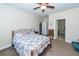 Bedroom with ceiling fan, bedside table and closet with access to the bathroom at 322 Freeland Way, Moncks Corner, SC 29461