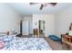 Bedroom featuring a ceiling fan, bedside table, and access to the bathroom at 322 Freeland Way, Moncks Corner, SC 29461