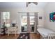 Bright dining area features wood floors and sliding glass doors to the outdoor patio at 322 Freeland Way, Moncks Corner, SC 29461