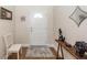 Bright entryway with white door, wooden console table, and laminate wood flooring at 322 Freeland Way, Moncks Corner, SC 29461