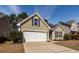Charming single-Gathering home with well-manicured front yard and a two-car garage at 322 Freeland Way, Moncks Corner, SC 29461