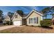 Charming single-Gathering home with well-manicured front yard and a two-car garage at 322 Freeland Way, Moncks Corner, SC 29461