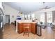 Open kitchen with breakfast bar, stainless steel appliances and access to dining and living area at 322 Freeland Way, Moncks Corner, SC 29461