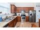 Well-equipped kitchen features stainless steel appliances, wood cabinetry, and sleek countertops at 322 Freeland Way, Moncks Corner, SC 29461