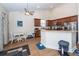 Bright kitchen featuring laminate floors, brown cabinets, and an open layout at 322 Freeland Way, Moncks Corner, SC 29461