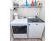 Well-equipped laundry room featuring a Maytag washer and dryer with convenient shelving above for storage at 322 Freeland Way, Moncks Corner, SC 29461