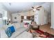 Open living room with vaulted ceiling, ceiling fan, open to kitchen and dining areas at 322 Freeland Way, Moncks Corner, SC 29461