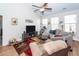 Cozy living room with vaulted ceiling, ceiling fan, and comfortable seating area at 322 Freeland Way, Moncks Corner, SC 29461