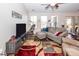 Comfortable living room with vaulted ceiling, ceiling fan, and neutral color scheme at 322 Freeland Way, Moncks Corner, SC 29461