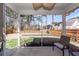 Relaxing screened porch with comfortable seating and a view of the fenced backyard at 322 Freeland Way, Moncks Corner, SC 29461
