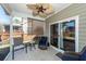 Inviting screened porch with ceiling fan, ideal for outdoor relaxation and enjoyment at 322 Freeland Way, Moncks Corner, SC 29461