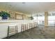 Bar with stools, paintings, and views of the ocean at 330 Concord St # 14 A, Charleston, SC 29401