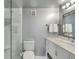 Bathroom with a walk-in shower and a white vanity with a marble countertop at 330 Concord St # 14 A, Charleston, SC 29401