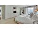 Bright bedroom with a large bed, water view, and custom built-in storage and shelving at 330 Concord St # 14 A, Charleston, SC 29401