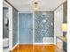 Entryway with light blue walls, textured wallpaper and a wooden parquet floor at 330 Concord St # 14 A, Charleston, SC 29401