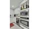 Kitchen features a built-in wine rack, stainless steel appliances and white cabinetry at 330 Concord St # 14 A, Charleston, SC 29401