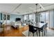 Bright living and dining room featuring water views, coffered ceilings, and hardwood floors at 330 Concord St # 14 A, Charleston, SC 29401