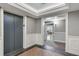 Hallway with elevator and entrance featuring elegant paneling, trim and tile flooring at 330 Concord St # 14 A, Charleston, SC 29401