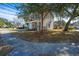 Charming two-story home with gray siding, red shutters, and an inviting front porch at 3621 Locklear Ln, Mount Pleasant, SC 29466