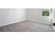 Bright bedroom with soft carpet flooring and a window with natural light at 363 Chapman Cir, Goose Creek, SC 29445