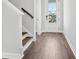 Inviting entryway featuring wood flooring and a staircase with white trim at 365 Chapman Cir, Goose Creek, SC 29445