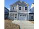 Two story home with a gray exterior, a driveway and front-facing two car garage at 365 Chapman Cir, Goose Creek, SC 29445