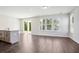Open living room with wood flooring, ample natural light, and sliding glass door at 365 Chapman Cir, Goose Creek, SC 29445