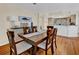 Dining area featuring hardwood floors and an open layout to the kitchen at 401 Yacht Harbor Ct, Isle of Palms, SC 29451