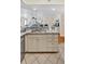 Kitchen island featuring granite countertops, stainless steel sink, and cream-colored cabinetry at 401 Yacht Harbor Ct, Isle of Palms, SC 29451